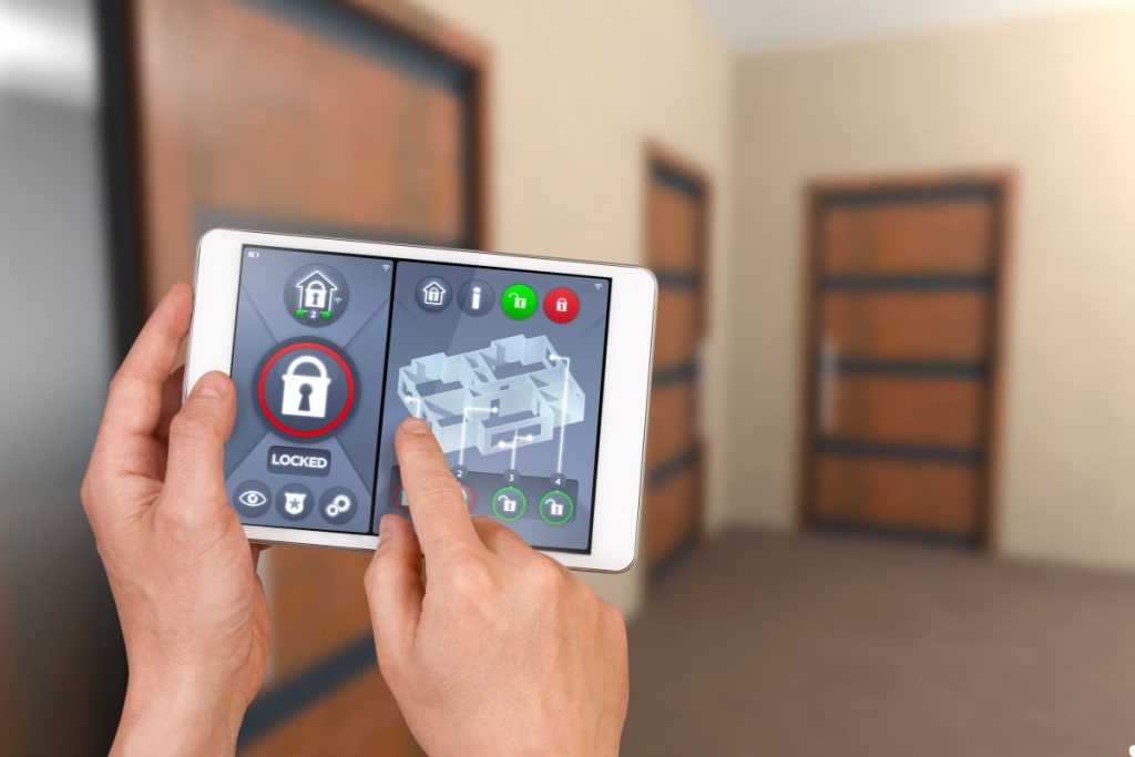 A person holding an iPad displaying a lock icon, symbolizing security or restricted access to the device.